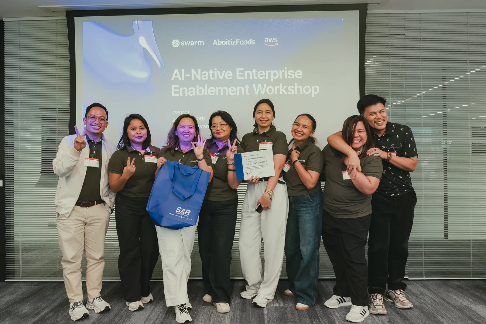 Aboitiz Foods workshop group celebrating with their completion kits